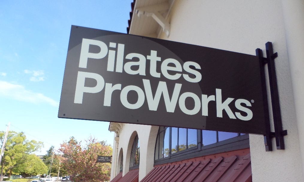 Well Design Pilates ProWorks Projecting Identity Sign Napa Street Tower