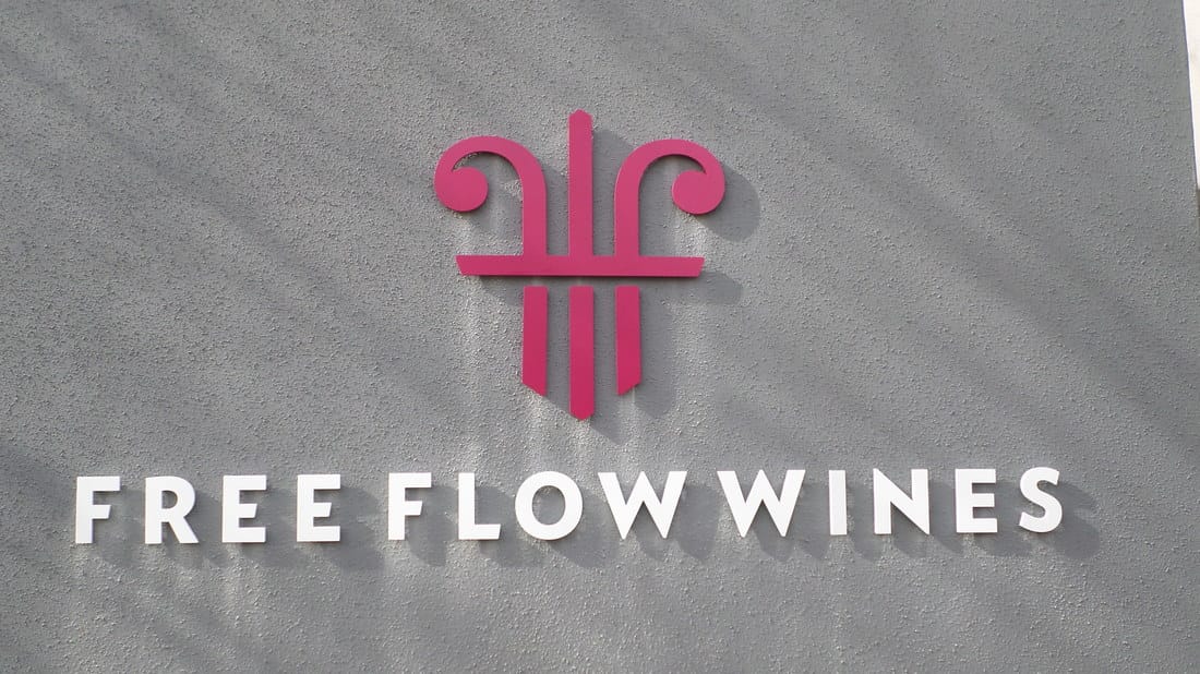 Well Design Free Flow Wines Wall Sign
